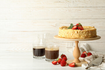 Concept of tasty lunch with stand with Napoleon cake with strawberry