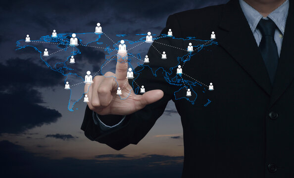 Hand click businessman icon with world map connection lines over sunset sky, Business communication concept, Elements of this image furnished by NASA