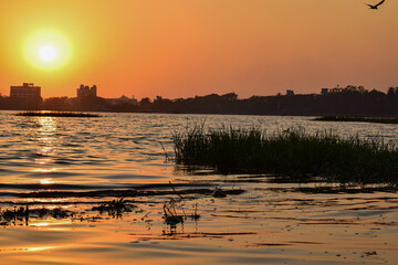 Naklejka premium A beautiful calm and golden sunset at rankala lake in kolhapur city.
