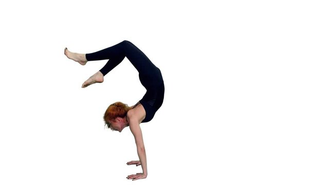 Slim woman in black bodysuit standing on hands during yoga practice, Full HD footage with alpha transparency channel isolated on white background