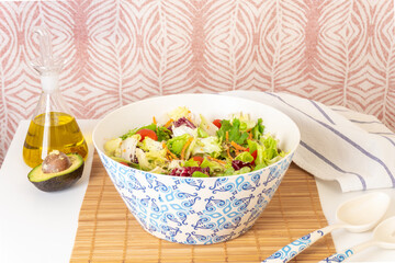 Salad with olive oil, avocado, vegetables and seeds