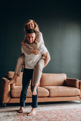 Photoshoot of a young couple in love. The solitude of a guy and a girl. Studio photography. 