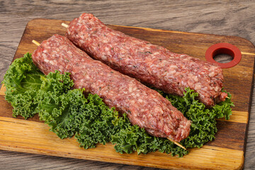 Raw minced beef kebab skewer