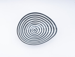 Porcelain bowl with concentric circles - op art object isolated