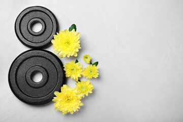 8 March greeting card design with chrysanthemum flowers, weight plates and space for text on light...