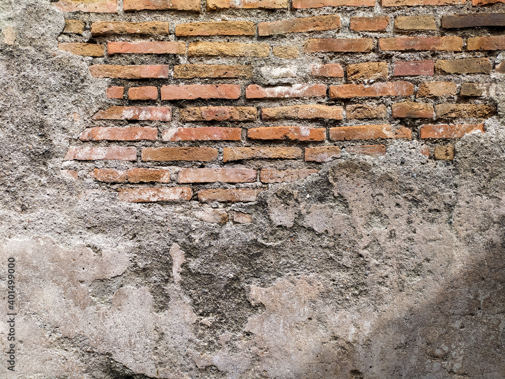 Wall mural old walls that have started to peel off and look red bricks.