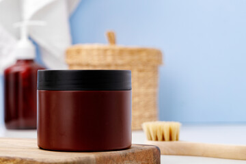 Brown skicare container against blue bathroom background