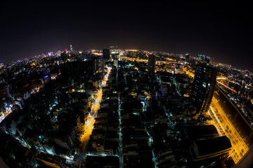 Fototapeta na wymiar Beautiful night city, cityscape of Ho Chi Minh city, Vietnam, modern futuristic architecture nighttime illumination, luxury traveling concept.