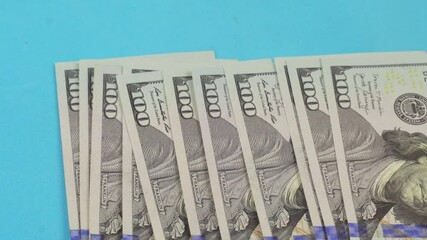 men's hands place 100 dollar bills on the table and count them. Exchange of money. Banking operation. Financial services. Financial market. A foreign currency exchange office. Concept. Mortgage on the