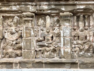Hindu God deity statue. Ancient sandstone carved historical Hindu God sculptures in the temple walls.