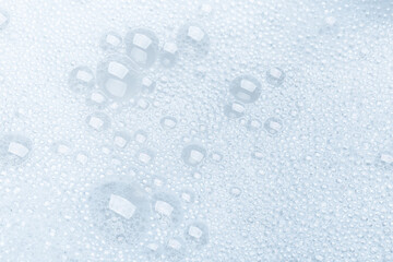 Background of soap foam and bubbles on a white background, macro photography