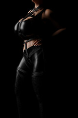 Mistress in shiny black latex costume and leather straps - obrazy, fototapety, plakaty