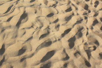 closeup of sand pattern of a beach in the summer