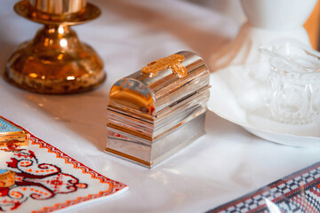 The Sacrament of Baptism. Attributes of the Orthodox priest for baptism, the golden box of peace....