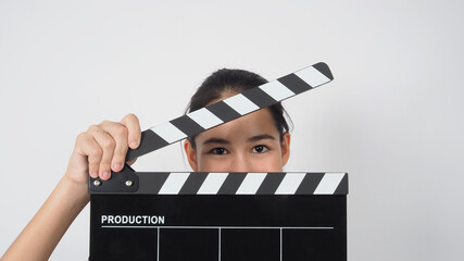 asian young woman holding black clapper board or movie slate or Clapperboard ,use in video...