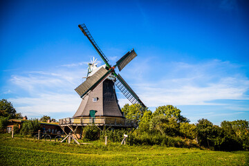 Fototapeta na wymiar Historical windmill in Ascheberg at the Great Ploen lake in Schleswig-Holstein, Germany