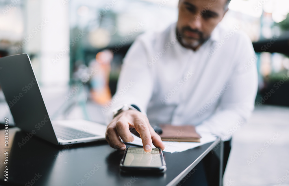 Aufkleber blurred businessman using smartphone keyboard for texting informative message and sending sms during