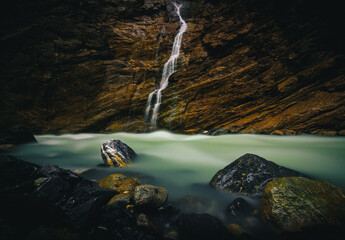 Waterfall in the Glaciercave Grindelwald, Switzerland, swiss alps, freeze, long exposure, river, water, rocks, stones