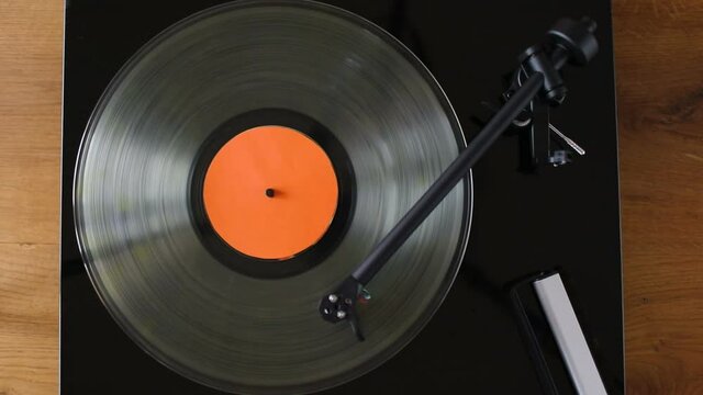 Turntable playing vinyl record, directly above