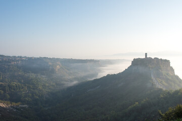 Fototapeta na wymiar It is a village of Civita di Bagnoregio in Lazio, Italy. Surrounded by the sea of clouds in the morning, it is a fantastic landscape.
