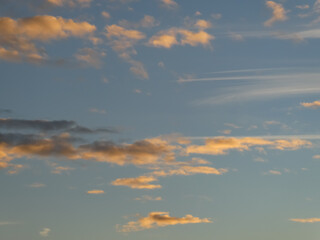 Naklejka na ściany i meble photo of the sky with a beautiful sunrise and golden clouds