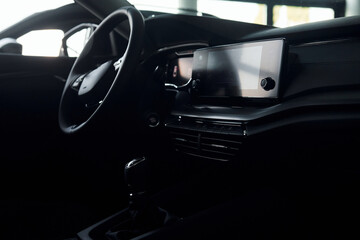 Inside of front part. Close up focused view of brand new modern black automobile
