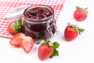 Delicious strawberry jam in a glass jar