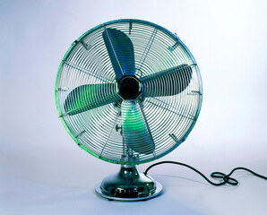 Metallic electric fan isolated on grey background