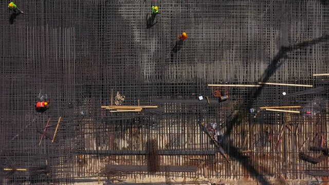 Mega Construction site with work in progress, Top down aerial view.