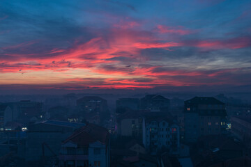 Fototapeta na wymiar Beautiful red and blue clouds over small Serbian town of Jagodina