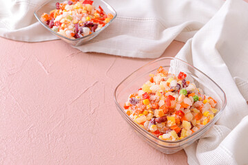 Fototapeta na wymiar Frozen vegetables in bowls on color background