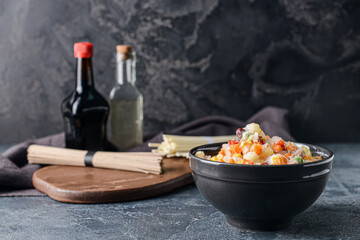 Frozen vegetables in bowl on dark background