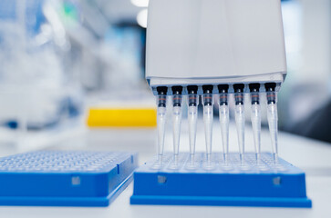 8-channel pipette and 96-well test plate. Genetic laboratory research technician. medical research...