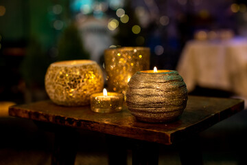 Candle ornament on wood blurry background