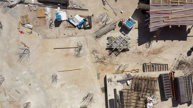 Mega Construction site with work in progress, Top down aerial view.