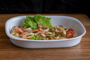 Pork meat grilled with fresh salad