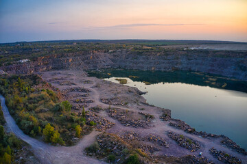 Old flooded stone quarry, site of natural granite stone mining