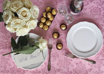 Date.Set table for two with white roses, wine and a note of love.Space for text.