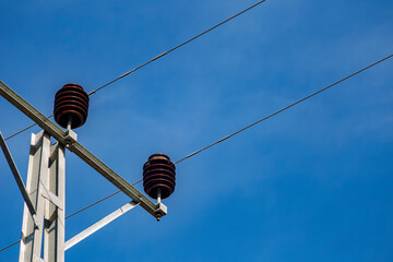 Electrical pole and line with sky.