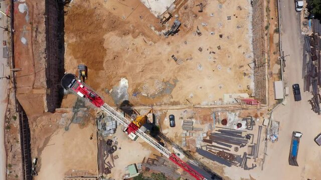 Mega Construction site with work in progress, Top down aerial view.