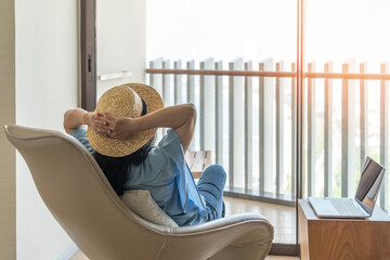 Relaxation healthy living lifestyle summer holiday vacation of freelancer woman take it easy resting in comfort chair in resort hotel balcony having peace of mind and self health quality balance