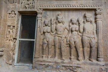 Buddha sculptures on wall at entrance to the largest Kanheri cave at Sanjay Gandhi National Park, Mumbai, India