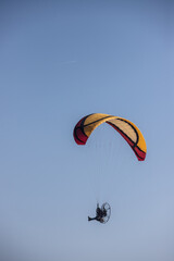 motor glider in blue sky