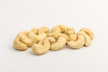 Raw cashew nuts isolated on white background.