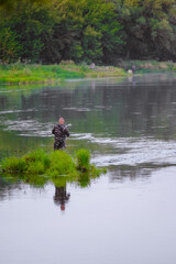 A man near the water. Fishing on the river