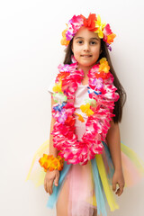 little girl in hawaiian costume isolated white background