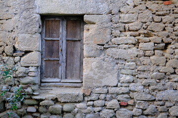 Fototapeta na wymiar An abandoned house in the west of France. A closeup of a window.