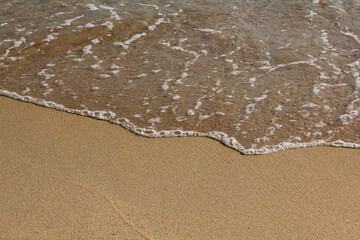 brown Sand beach and Wave foam.