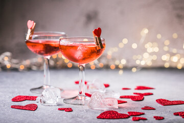 Festive pink cocktail with champagne or prosecco  for St. Valentine's day. Couple of glasses