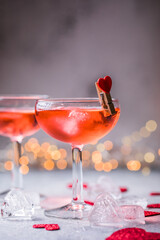 Festive pink cocktail with champagne or prosecco  for St. Valentine's day. Couple of glasses